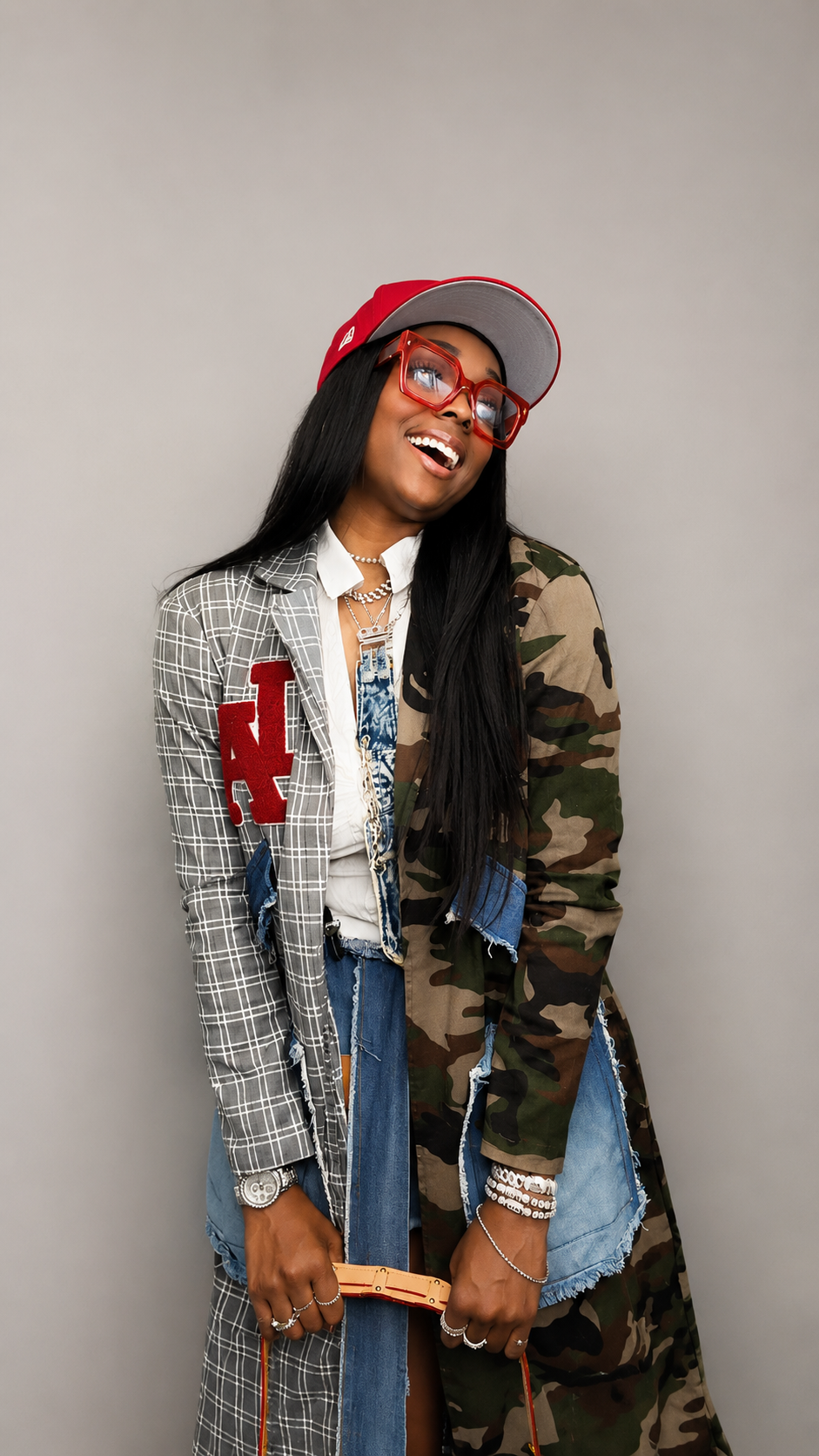 Recording artist XaniWorld wearing a fashion-forward mixed-pattern outfit